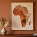 A single large framed africa map wall art print in warm terracotta and cream tones above a walnut console