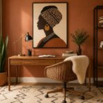 Afrocentric home office ideas — terracotta wall, Black female portrait above acacia desk, tribal rug, brass lamp