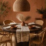 Afro-boho dining room with walnut table, rattan chairs, mudcloth runner, woven pendant light, terracotta vases