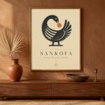 DIY Sankofa wall art print framed in natural oak above a walnut console with terracotta vase and brass candle holder