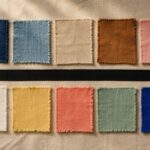 Senegal color palette guide — ten dyed-cloth swatches from Dakar indigo to Lake Retba pink